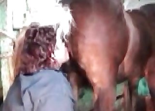 Filthy woman providing a rim job to a handsome pony