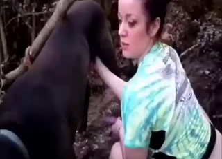 Girl plays with her pussy before sucking a dog off